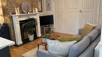Traditional Apartment | Living area | 32-inch Smart TV with digital channels, fireplace