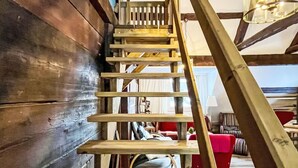 A wooden staircase with a handrail leading to an upper level. - Schwarzwaldhof mit Pool & Sauna by Interhome (Görwihl)