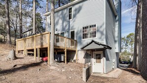 A two-story house with a wooden deck, a garage, and a small porch. - 8 Mi to Augusta National: Group Getaway w/ Deck (Augusta)