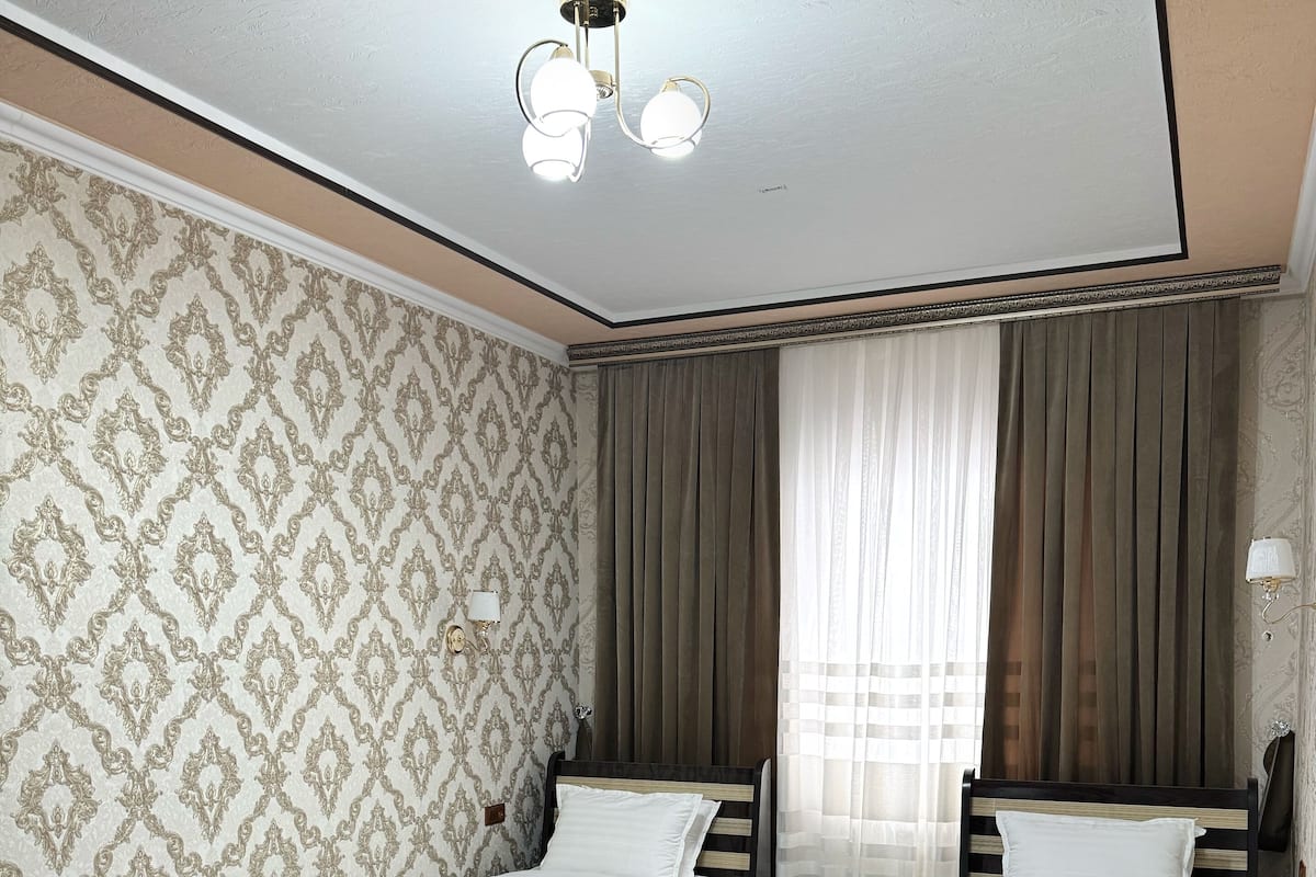 Family Double or Twin Room, Courtyard View | In-room safe, desk, blackout drapes, free WiFi