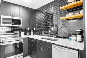 Fridge, microwave, oven, stovetop - Newly Renovated Beach Front Condo with partial Ocean View - Top of the Gulf 310 (Panama City Beach)