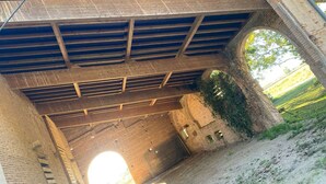 A large, open, industrial-style bridge with a wooden floor and metal beams. - The Oasis Gardens, Beautiful House (Barry-d'Islemade)
