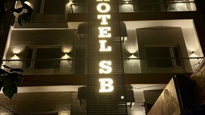 A hotel with a prominent illuminated sign reading "HOTEL SB". - Hotel Silver Bricks (Amritsar)