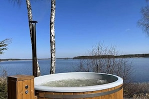 Outdoor spa tub - Holiday villa with sauna, on the shore of the lake (Radogoszcz)
