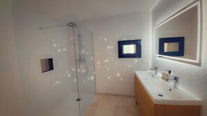 Shower, hair dryer, towels, toilet paper