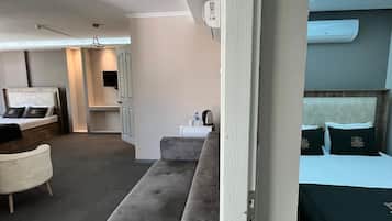 Family Quadruple Room, City View | Desk, laptop workspace, free WiFi