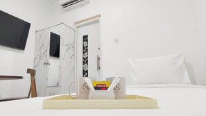 Standard Single Room | Desk, laptop workspace, blackout drapes, soundproofing - NN House Smart Stay (Jakarta Selatan)