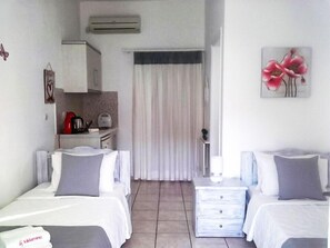 Standard Twin Room, Sea View | Free minibar items, laptop workspace, soundproofing, iron/ironing board - Kiklamino Sunset Studios (Santorini)