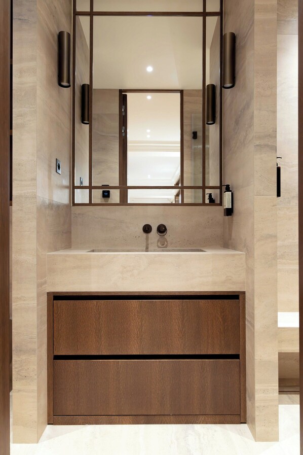 A modern bathroom with a large mirror, a sink, and a wooden cabinet. - Luxury A/C Apt - 10p/4bdr - Arc de Triomphe (Paris)