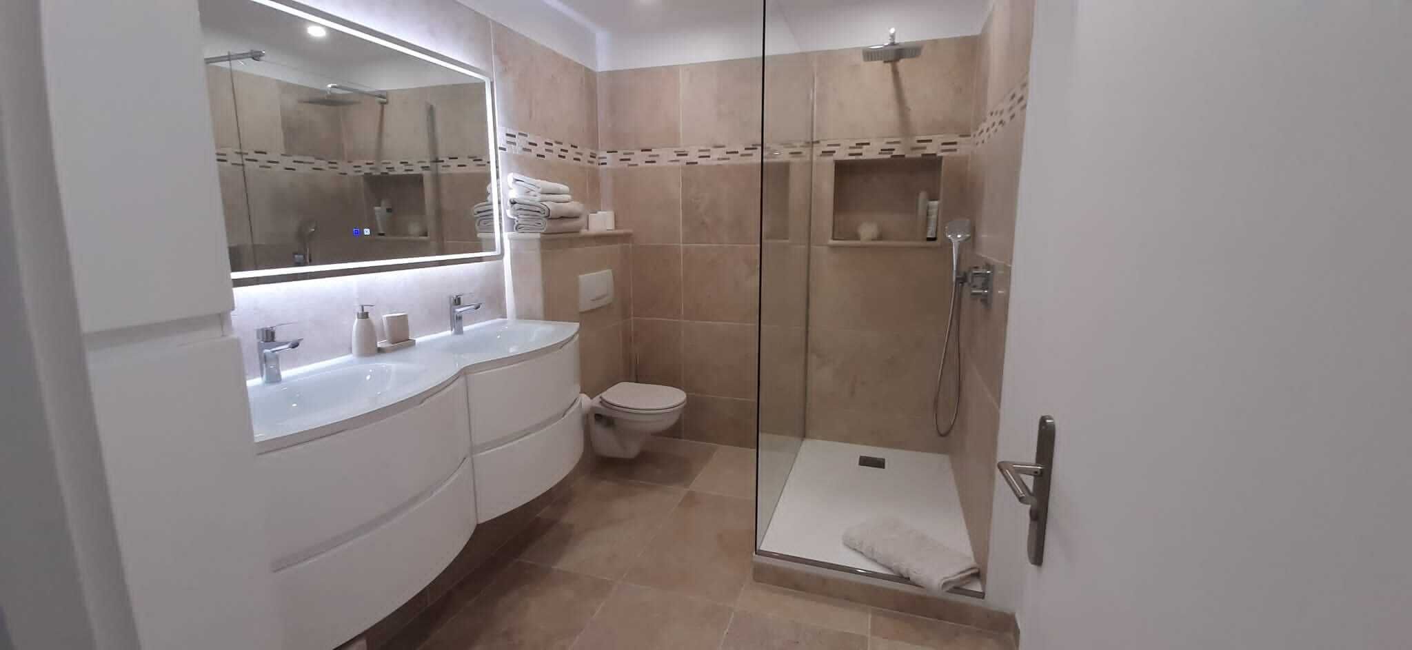 Shower, hair dryer, towels, toilet paper