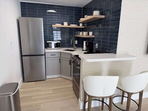 Fridge, microwave, oven, stovetop - Updated Studio in Boutique Mid-Century Building (Fort Lauderdale)