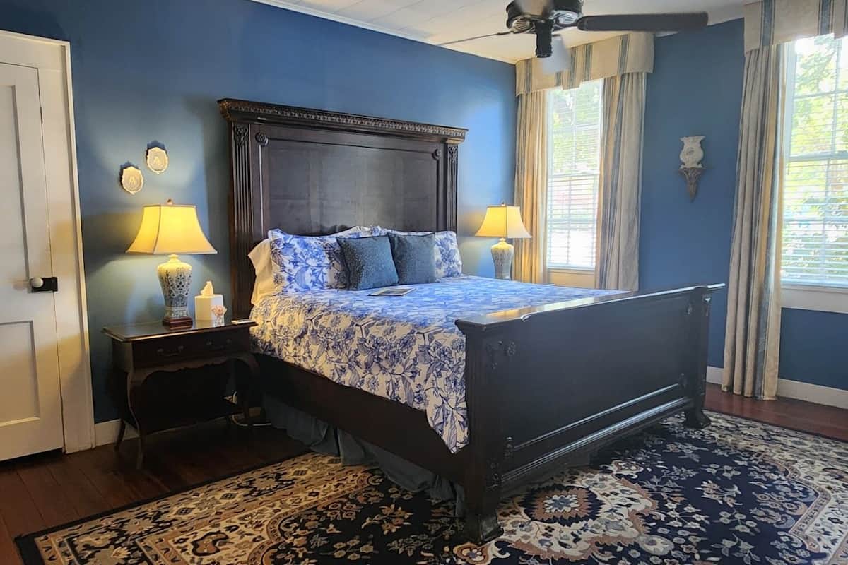 Deluxe Suite, Private Bathroom, Ground Floor | Blackout drapes, iron/ironing board, free WiFi