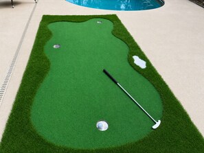 A miniature golf course with a putting green, a hole, and a golf ball. - 6 Bedroom Pool property. Pet Friendly (Melbourne)
