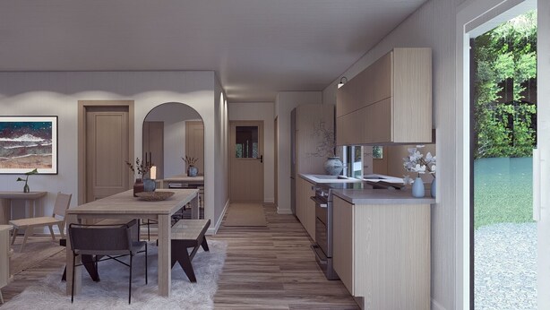 A modern kitchen with wooden cabinets, a dining area with a table and chairs, and a view of a garden through a glass door. - The Goldenrod - Catskills Mountain Retreat (Parksville)