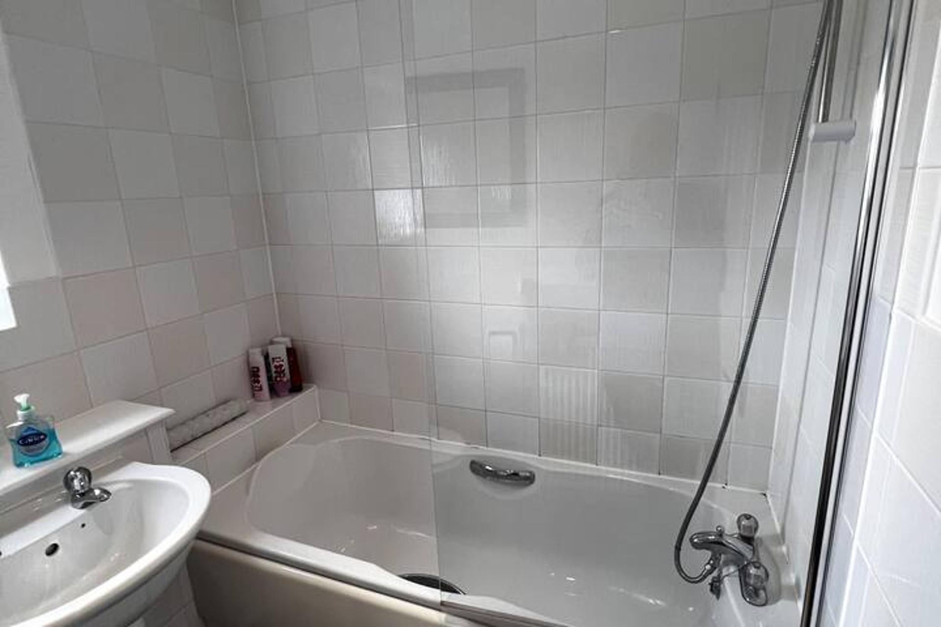 Separate tub and shower, deep soaking tub, hair dryer, towels
