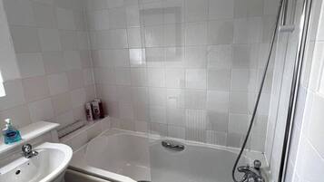 Separate tub and shower, deep soaking tub, hair dryer, towels