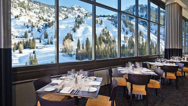 A restaurant with tables set for dining, large windows offering a view of a snowy mountain landscape. - Snowbird Cliff Lodge Resort Studio 1BR+/1B...Ski-In/Ski-Out, Full Resort Access (Sandy)
