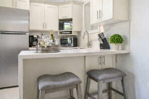 Fridge, microwave, stovetop, coffee/tea maker