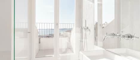 Shower, hair dryer, towels, shampoo
