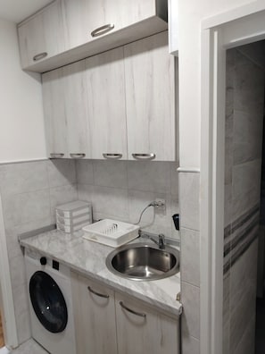 Studio, 1 Bedroom, Smoking, City View | Laundry