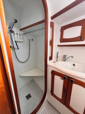 Shower, towels, soap, toilet paper