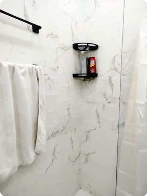 Shower, towels, soap, toilet paper