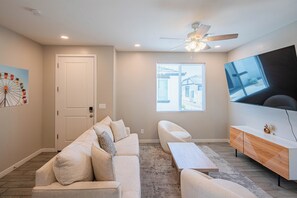 Apartment | Living area | 65-inch Smart TV with cable channels - The One 316 (Glendale)