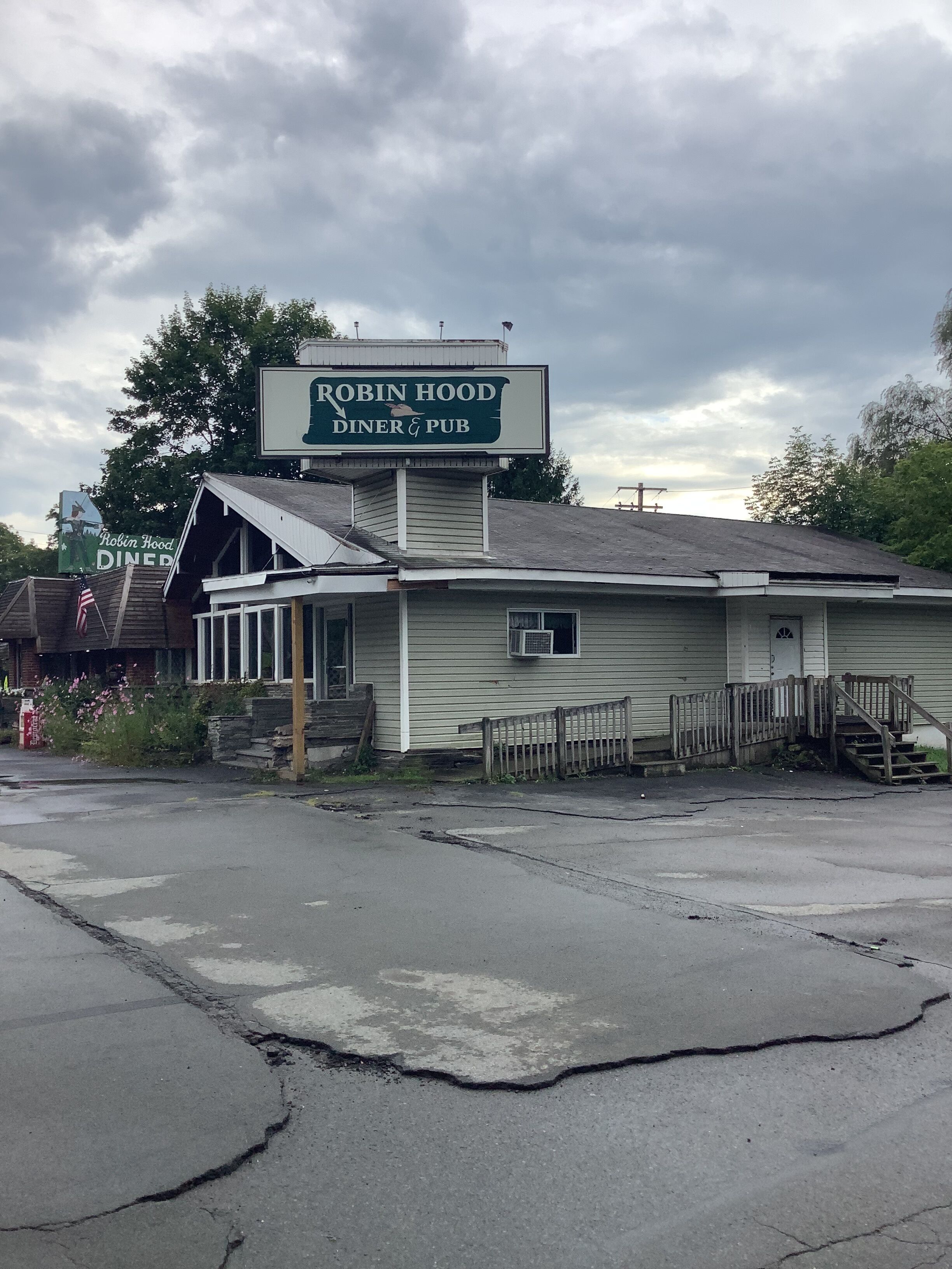 A diner with a sign reading "Robin Hood Diner & Pub".