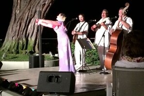 A stage with musicians performing. - Quiet, Charming studio apartment on a private street next to conservation land (Honolulu)