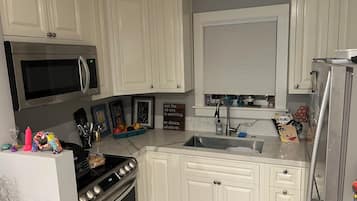 Fridge, microwave, toaster, cookware/dishes/utensils