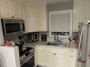 Fridge, microwave, toaster, cookware/dishes/utensils