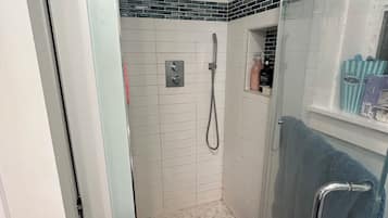 Shower, hair dryer, towels, soap
