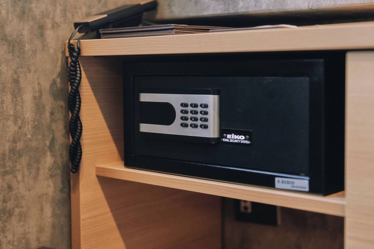 A security system with a keypad and a label reading 'EIKO TOTAL SECURITY SYSTEM.'