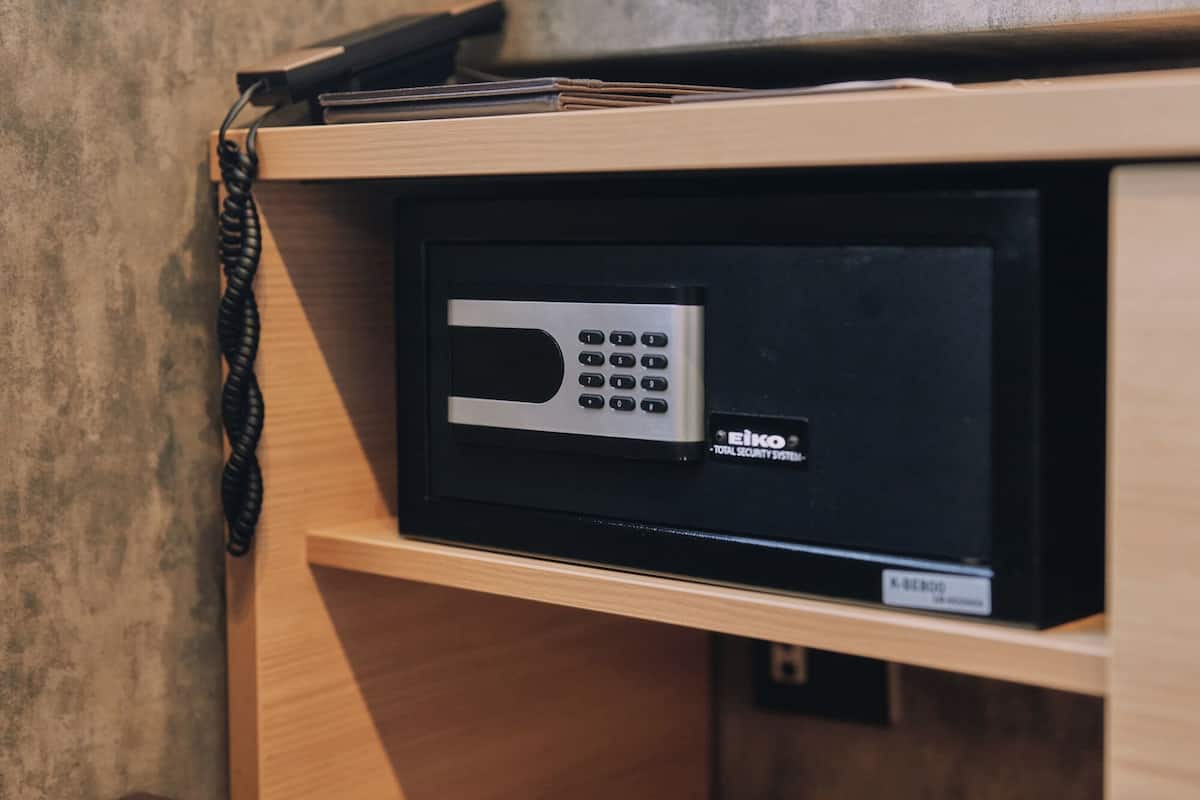 A security system with a keypad and a label reading 'EIKO TOTAL SECURITY SYSTEM.'