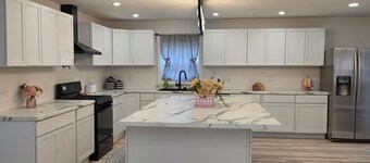 Modern & open 3-bedroom house with 3 stall garage in a perfect location..