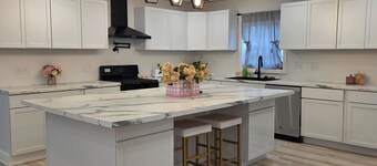 Modern & open 3-bedroom house with 3 stall garage in a perfect location..