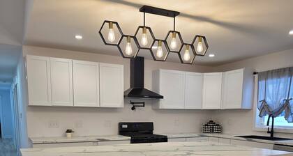 Modern & open 3-bedroom house with 3 stall garage in a perfect location..