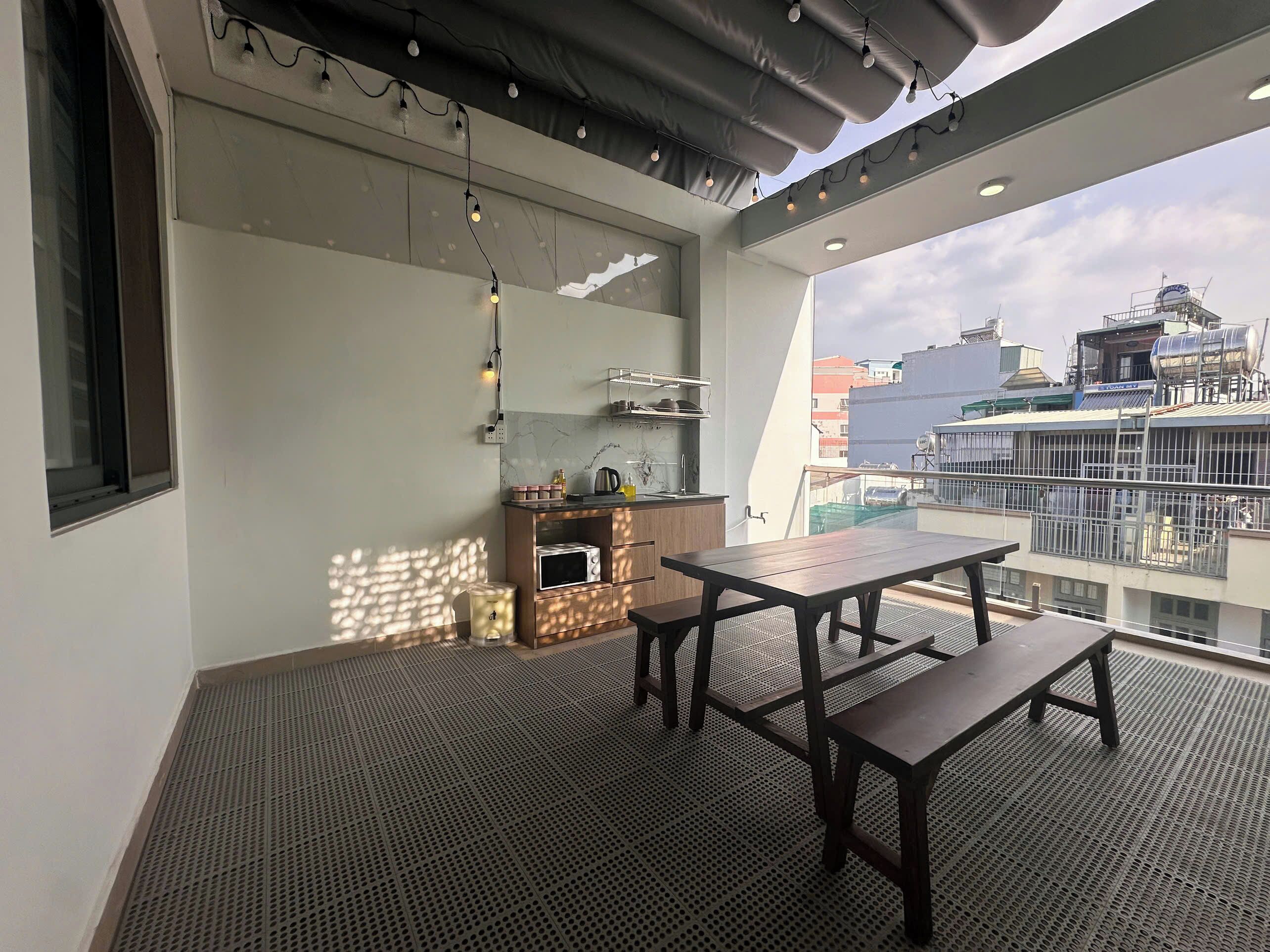 Deluxe Quadruple Room, Balcony, City View | Outdoor dining