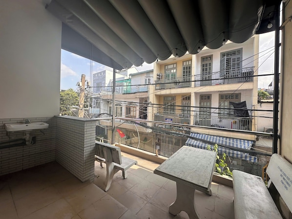 Family Quadruple Room, Balcony, City View | Outdoor dining - AP Home (Tan Binh)