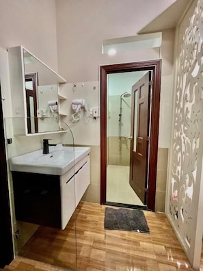 Family Quadruple Room, Balcony, City View | Bathroom | Shower, hair dryer, towels, soap - AP Home (Tan Binh)