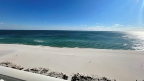 A beach with a clear sky and calm sea. - Lighthouse 1211, Spacious Beachfront Condo, Sleeps 8, 3 pools.  Owner managed. (Gulf Shores)