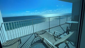 A balcony with a view of the ocean and beach. - Lighthouse 1211, Spacious Beachfront Condo, Sleeps 8, 3 pools.  Owner managed. (Gulf Shores)