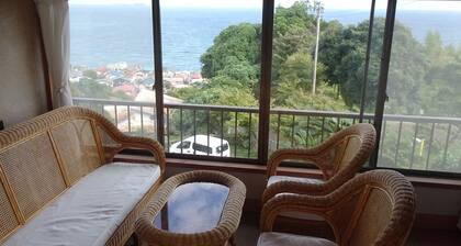 Inn in an old house connecting the blue sea and travelers by post