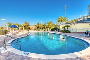 A swimming pool with a 6 FT depth marker, surrounded by palm trees and lounge chairs. - 2nd floor condo w/ gym, shared pools, balcony, restaurant, near theme parks (Davenport)