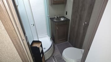 Shower, towels, soap, toilet paper