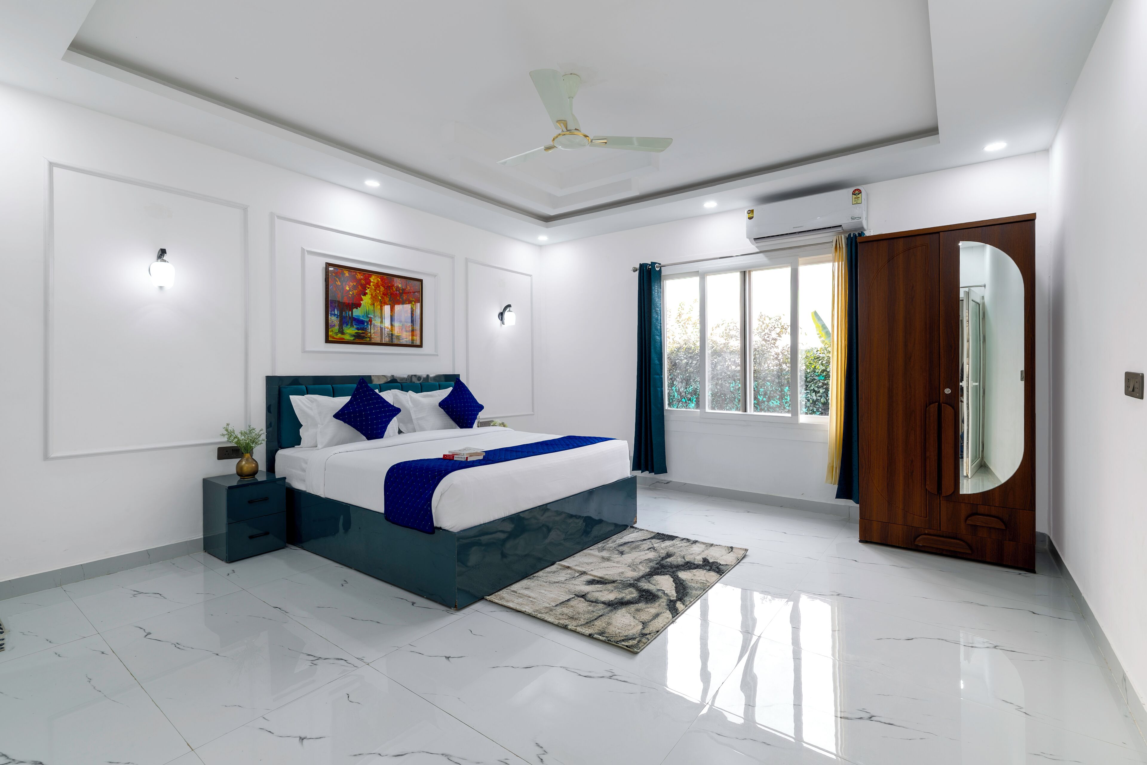 A modern bedroom with a bed, nightstands, a ceiling fan, and a large window with curtains.