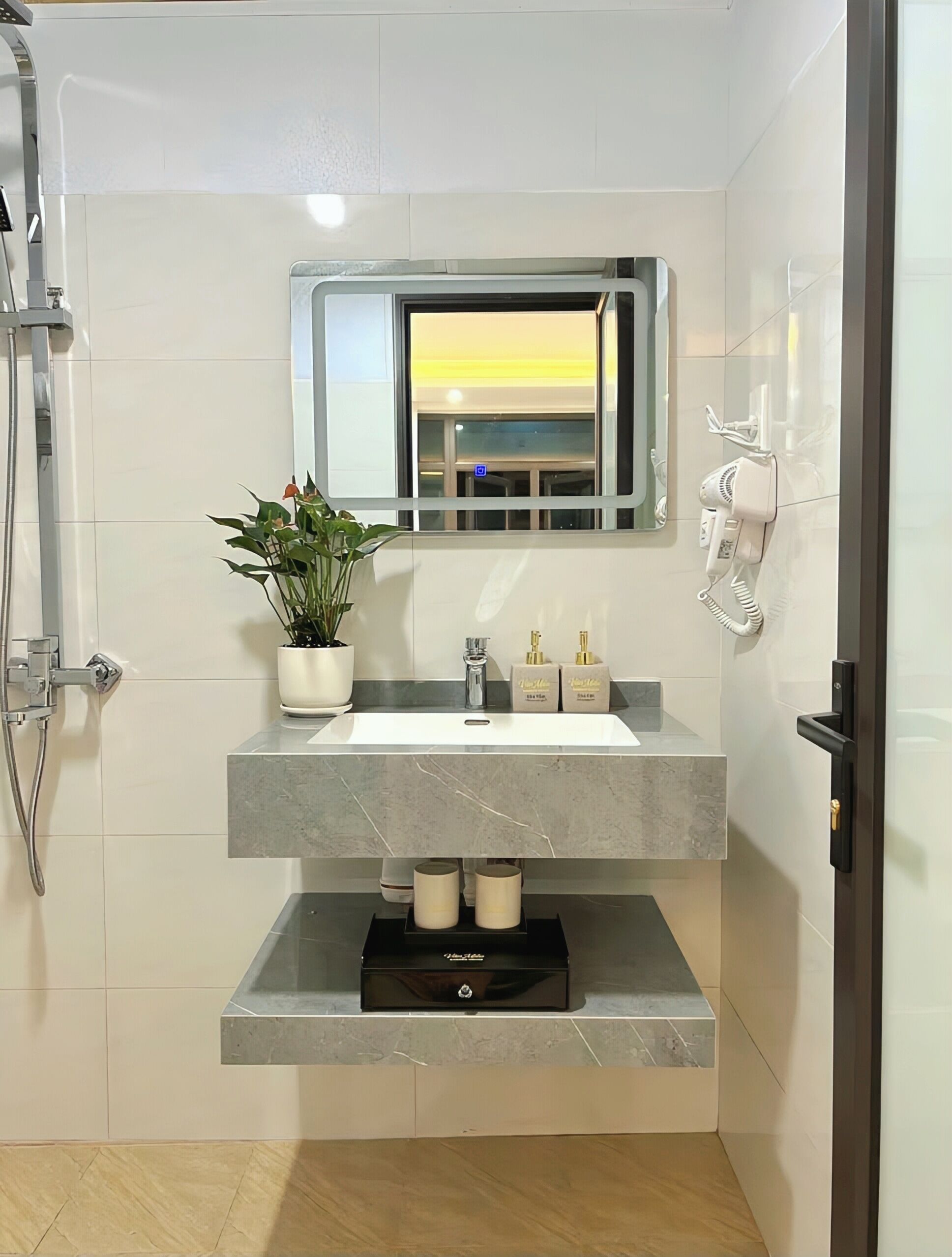 Shower, hair dryer, towels, soap