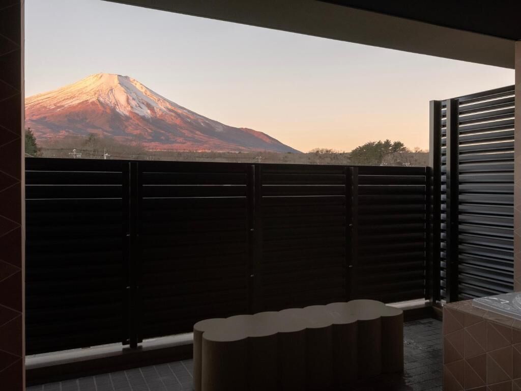 A balcony with a view of a mountain.