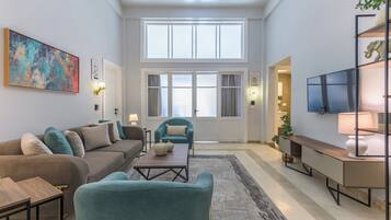 House, 4 Bedrooms, Balcony, City View | Living area | 43-inch Smart TV with cable channels, Netflix, streaming services