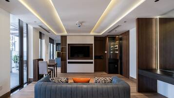 Penthouse, City View | Living area | 40-inch LCD TV with cable channels